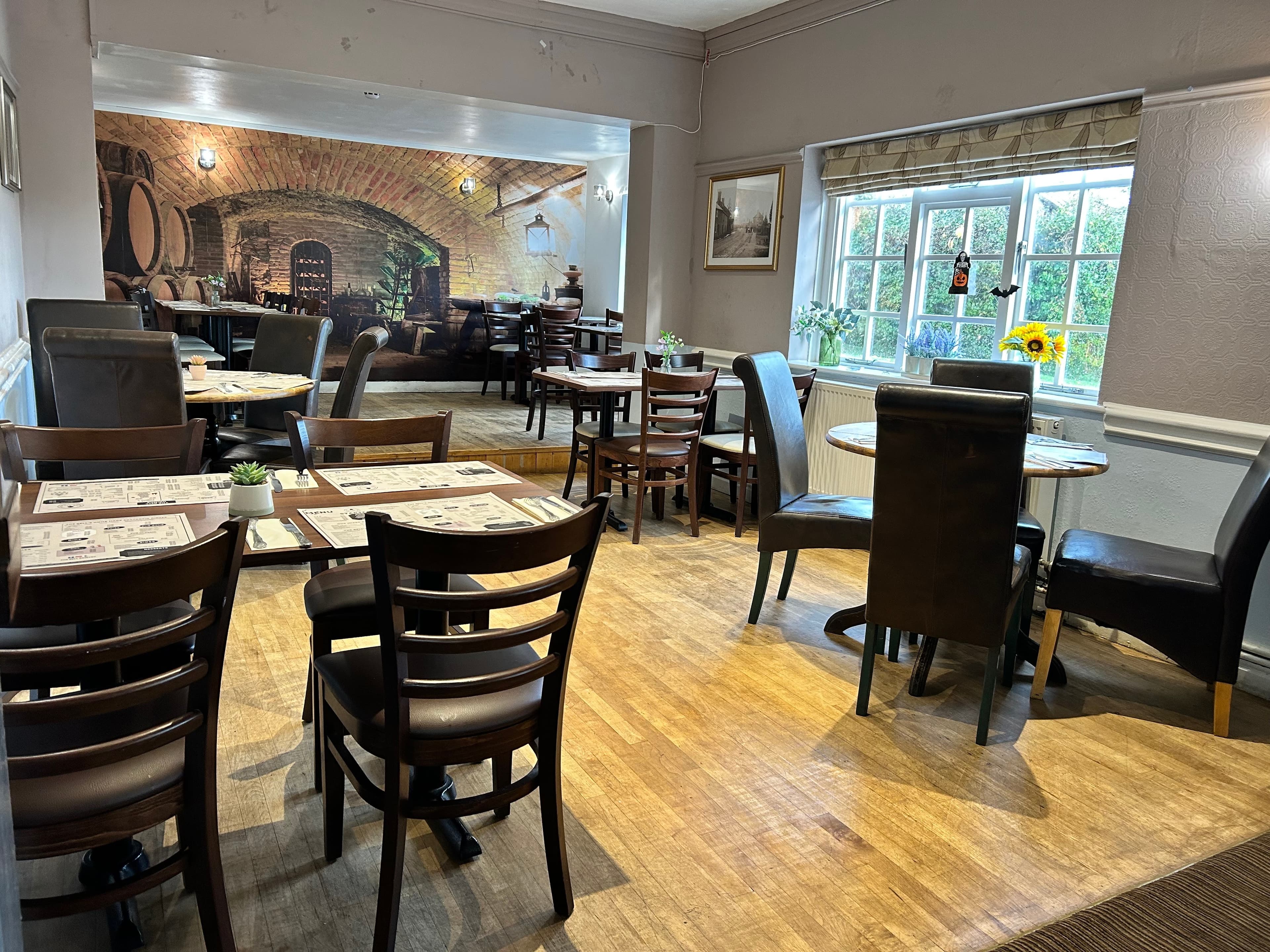 Interior seating area inside The Bell pub in Sawtry.